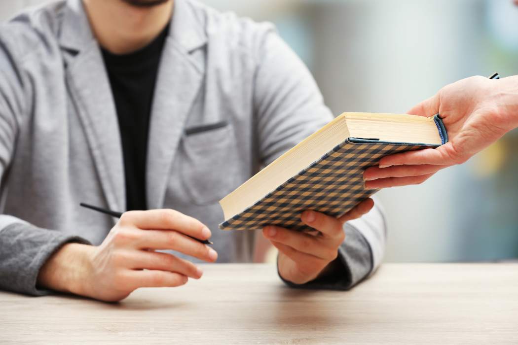 Author signing a book